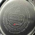 Боковая сторона корпуса Casio Casio G-Shock GA-140-1A4DR (GA-140-1A4) с заводной головкой и логотипом бренда